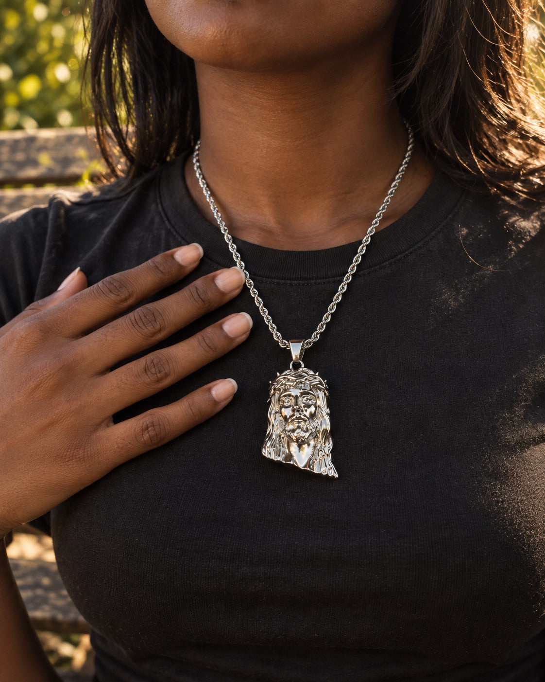 Crowned Saints Jesus Piece necklace worn on body